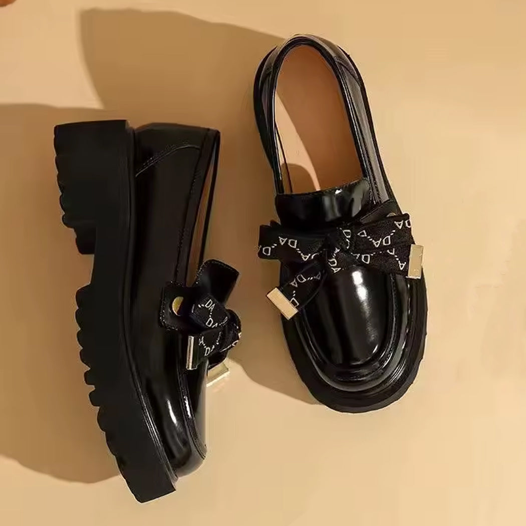 Mocassino platform nero con fiocco da donna