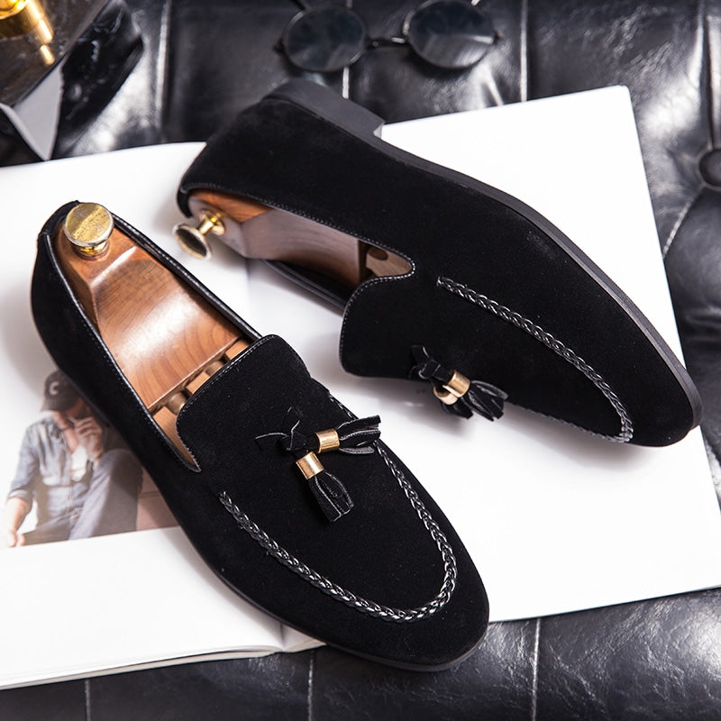 Mocassini con nappine in camoscio e torsade in pelle
