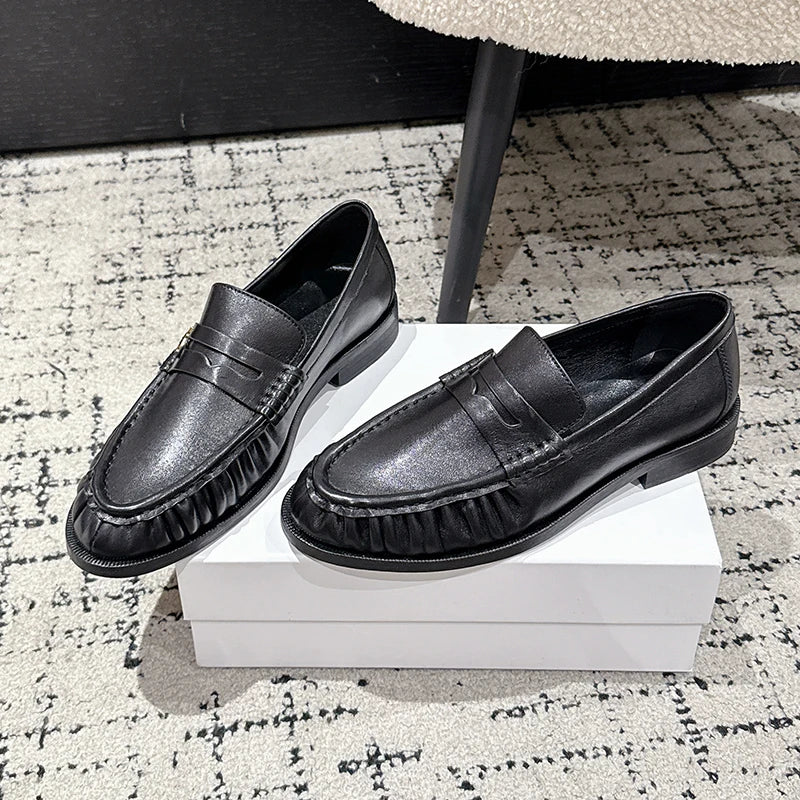 Mocassino penny donna nero in pelle liscia, vista laterale