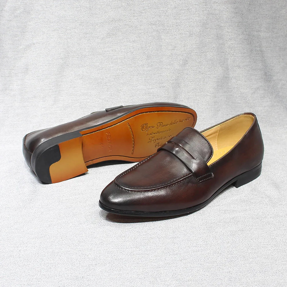 Coppia di mocassini penny marrone scuro